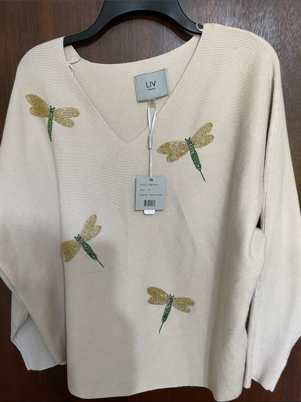 Liv Milano beaded dragonfly on a Dolman sleeve knit top
